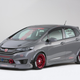Illustration for article titled A Honda Fit With A Grom In The Back Is Something We Need Yesterday